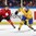 MALMO, SWEDEN - DECEMBER 26: Sweden's Robin Norell #3 looks to make the pass while Switzerland's Vincent Praplan #10 defends during preliminary round action at the 2014 IIHF World Junior Championship. (Photo by Andre Ringuette/HHOF-IIHF Images)